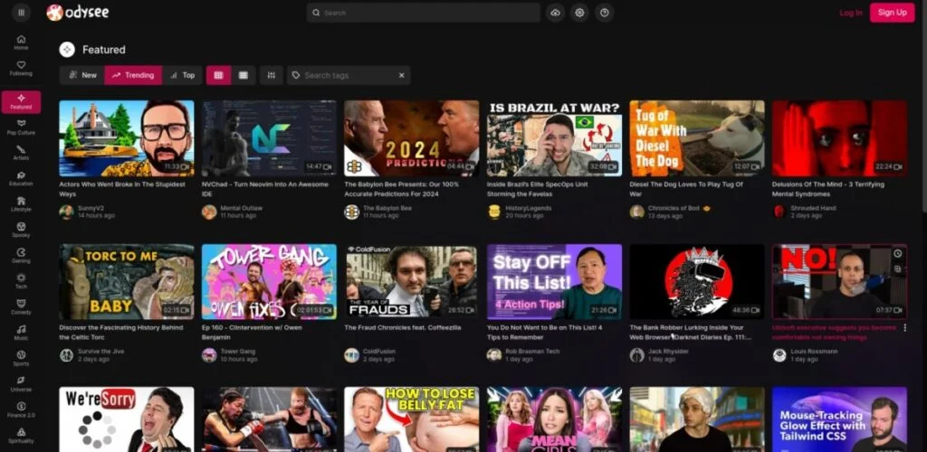 Screenshot of a video-sharing platform with a dark-themed interface, displaying various trending video thumbnails, titles, and creators. The platform's logo "Odysee," known as one of the best decentralized social media networks, is visible in the top left corner.