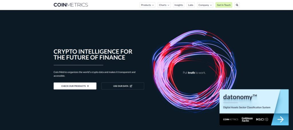 Screenshot of the Coin Metrics homepage displaying the slogan "Crypto Intelligence for the Future of Finance" with options to check products or use data. The site promotes digital asset data transparency.